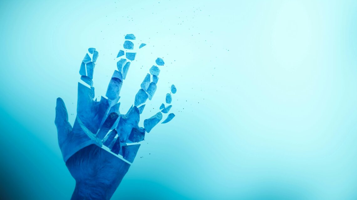 Abstract image of a blue hand breaking apart against a bright background.